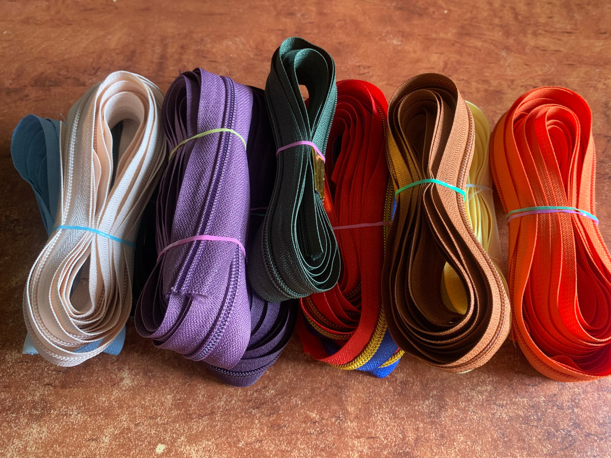 Mixed zipper tapes
