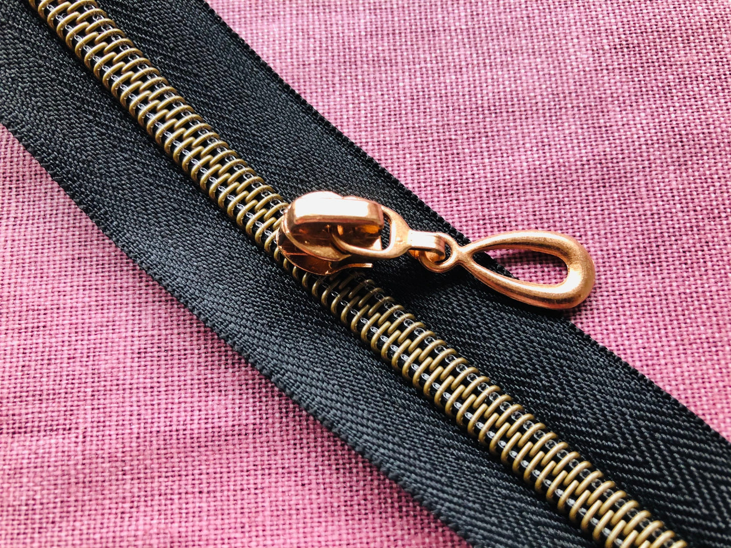 Teardrop metal zipper pulls