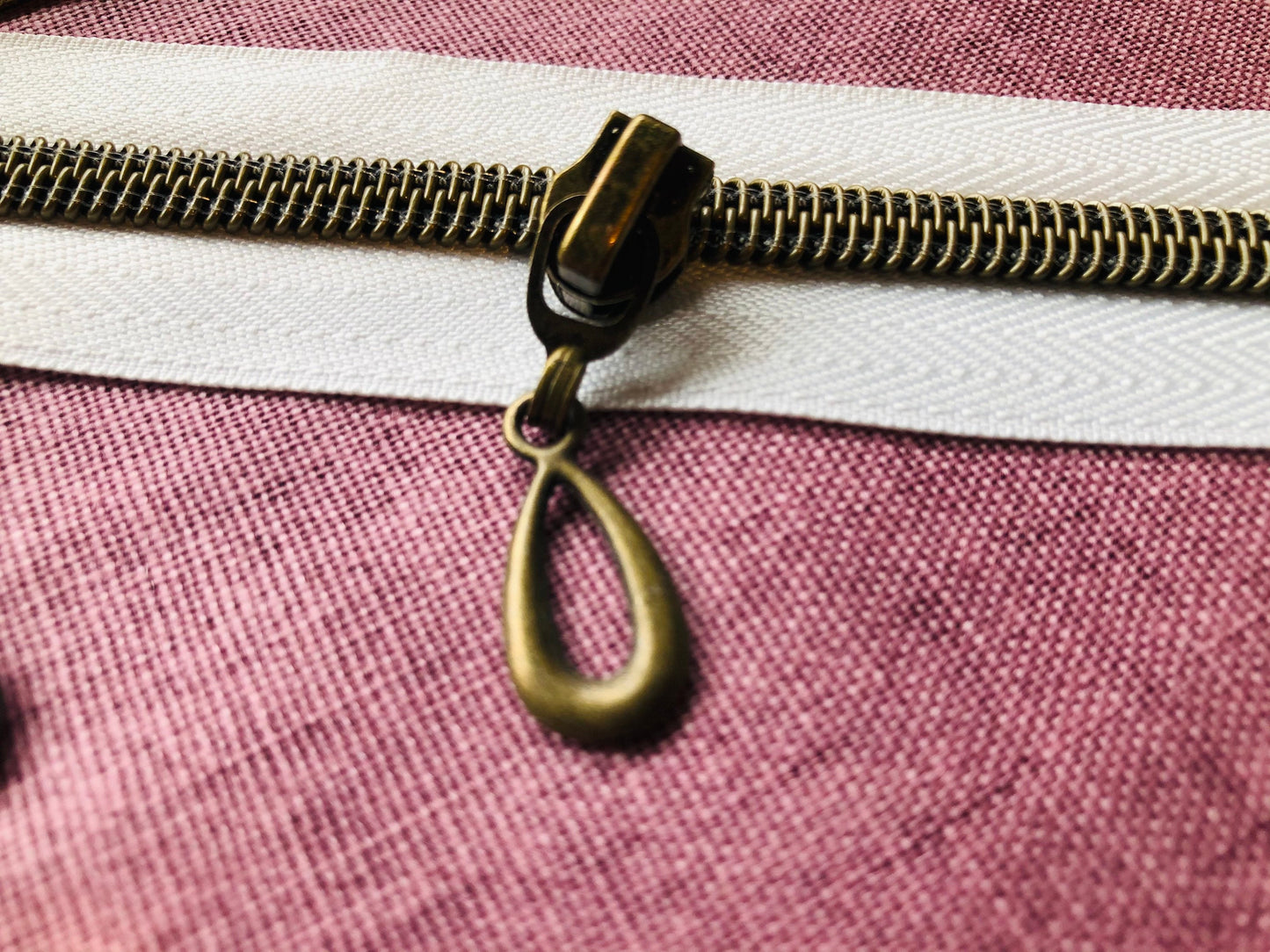 Teardrop metal zipper pulls