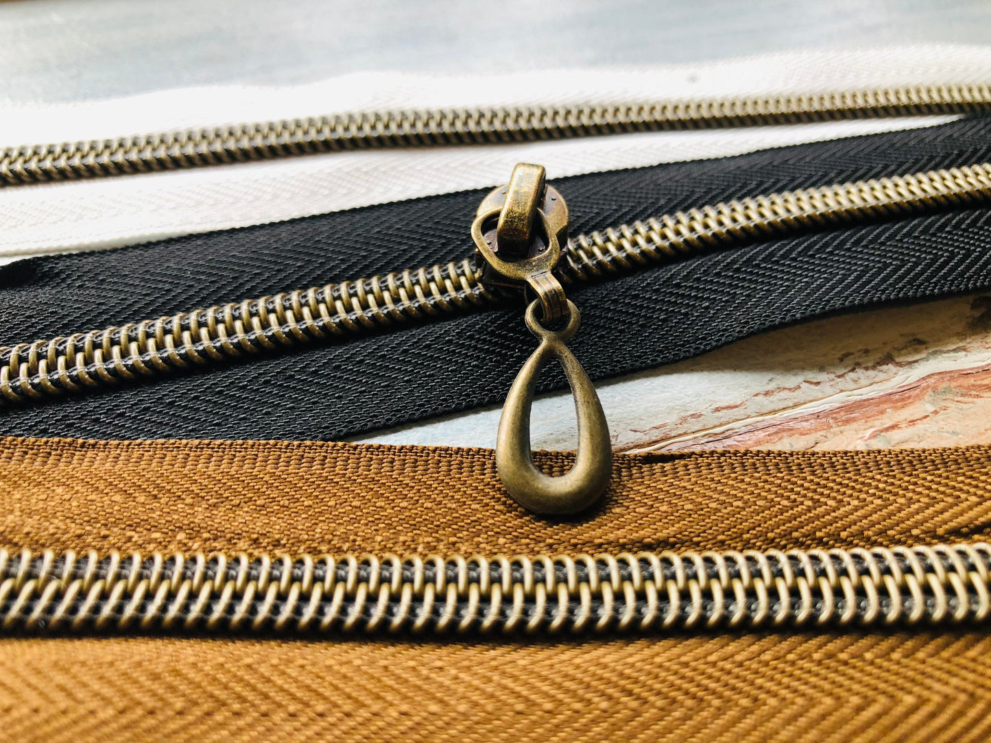Teardrop metal zipper pulls