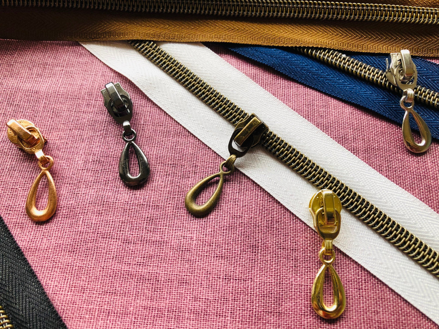 Teardrop metal zipper pulls