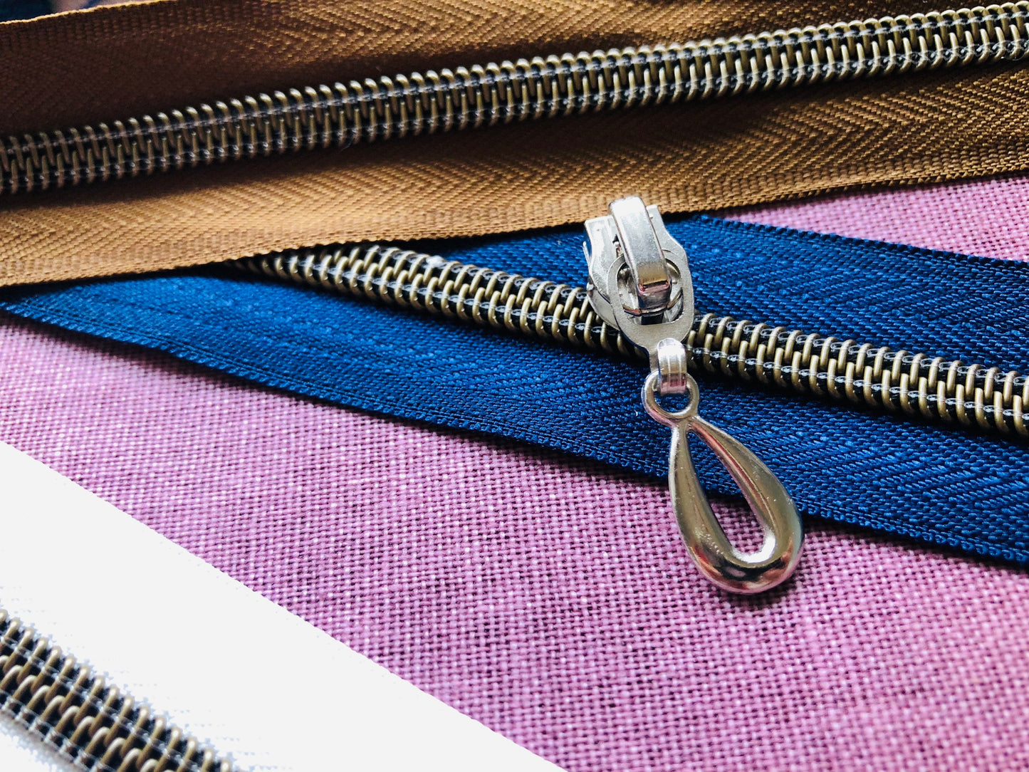 Teardrop metal zipper pulls