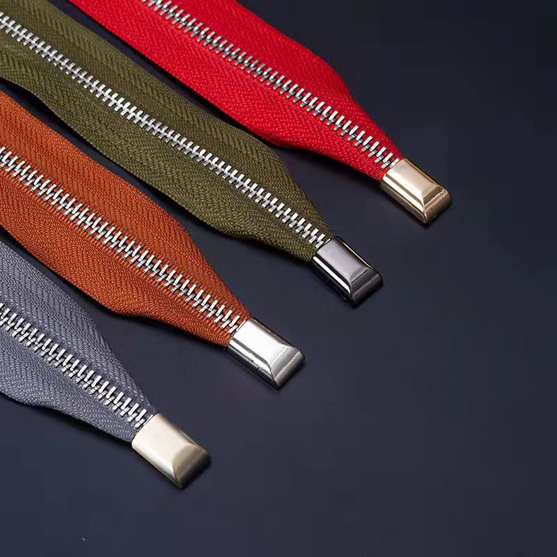 Metal zipper ends for bag making etc.