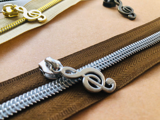 Music zipper pulls A3bl