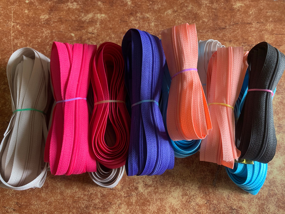 Mixed zipper tapes