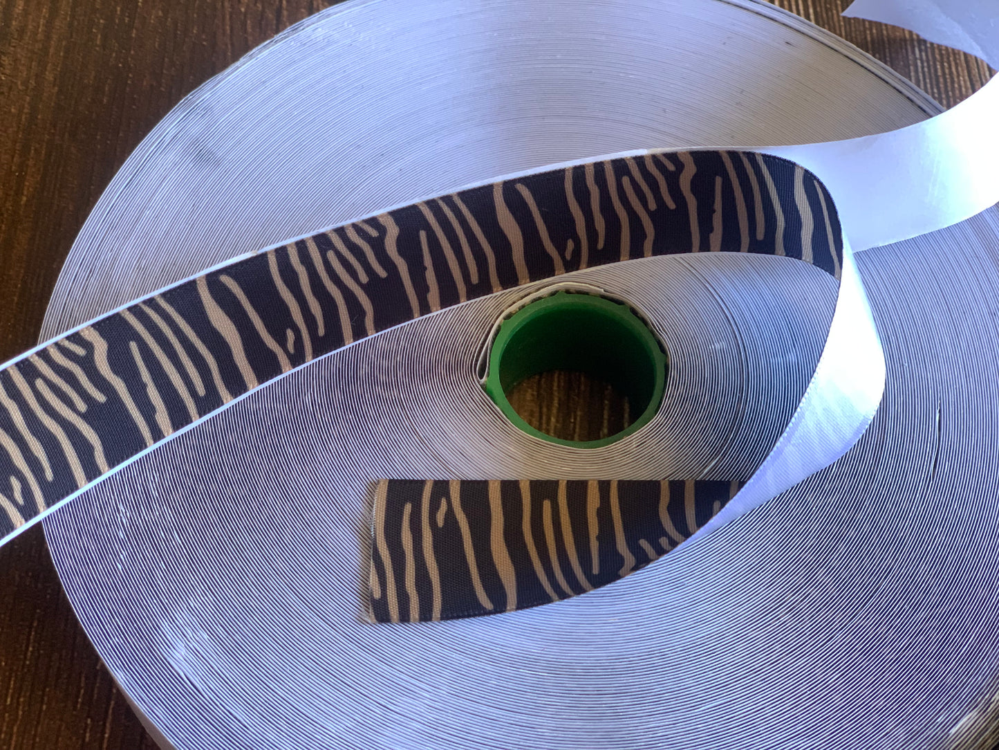 Self adhesive/smackdown binding tapes