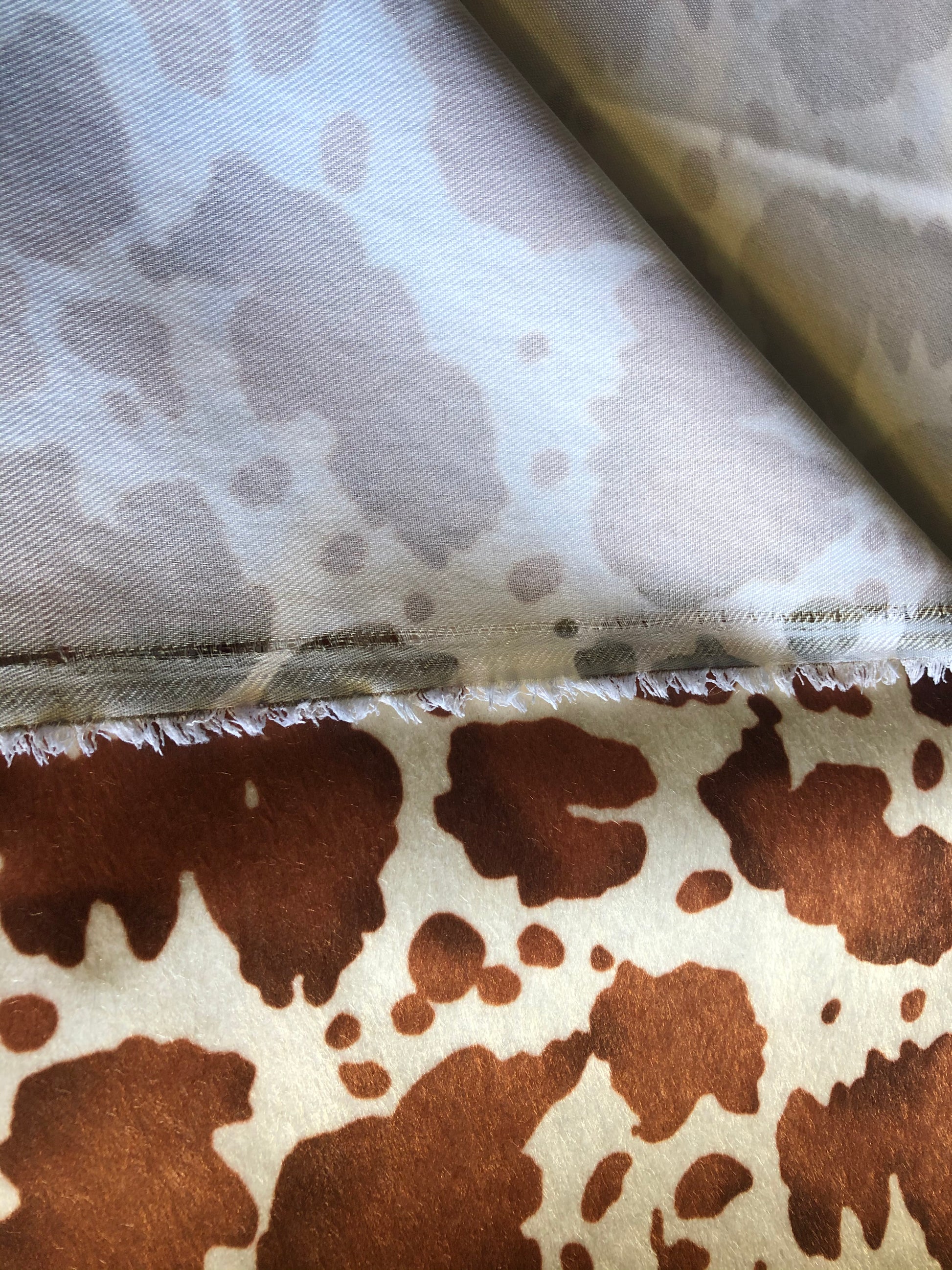 Ferdinand-Milk - A faux leather cow hide fabric from Chameleon