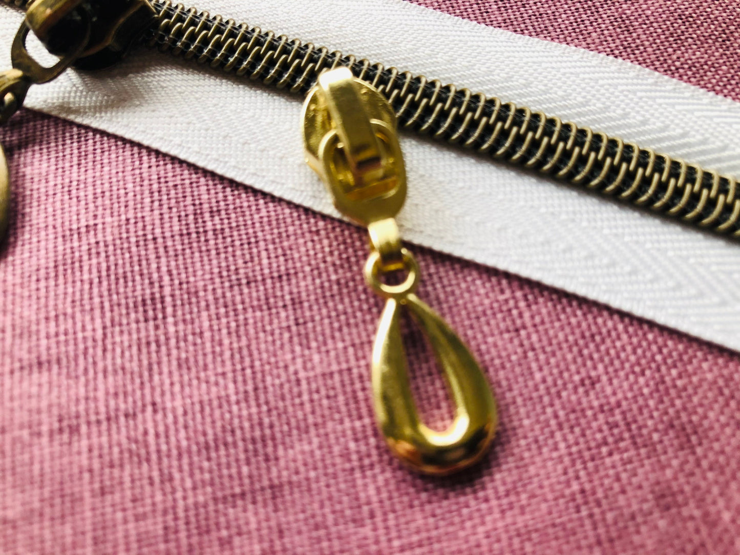 Teardrop metal zipper pulls