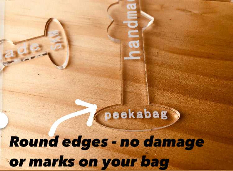 Peekabag, bag and wallet props, openers for interior display and photography